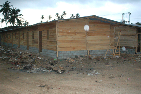 Temporary wooden structures being built to replace the tents.
