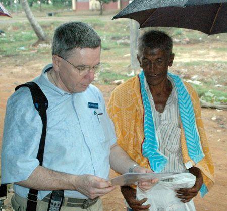 Charles Flood listening to D. W. Somesira